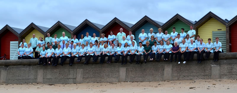 BVDF group photo next to beach huts